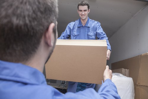 Moving team preparing a home move in Soho with boxes and furniture