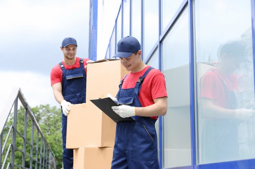 House removals team planning a move in Soho near busy central London streets