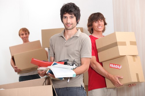 Business move preparation with furniture and equipment organised for transport