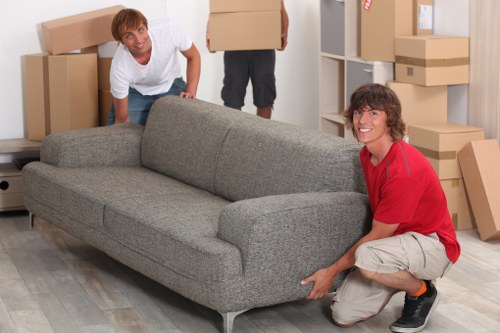 House removalists loading boxes and furniture in Soho street access conditions