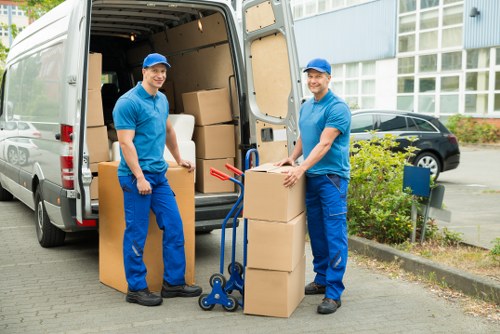 Local collection team handling a bulky sofa in central London