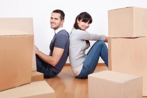 Prepared moving boxes and furniture for a Soho removal van