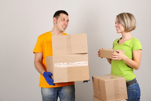 Insured Soho movers loading furniture with protective handling