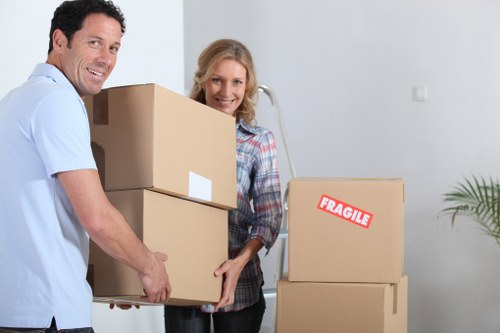 Packed office equipment and labelled boxes ready for a Soho business move